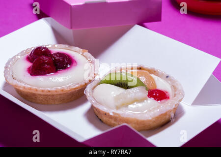 Two cream cakes with fruit. Two round cakes. View at an angle. Stock Photo