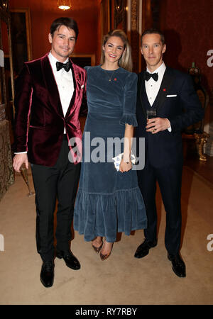 (left to right) Josh Hartnett, Tamsin Egerton and Benedict Cumberbatch at a dinner for donors, supporters and ambassadors of Prince's Trust International at Buckingham Palace in London. Stock Photo