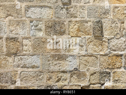 Decorative wall of colored stone bricks. Abstract background. Stock Photo