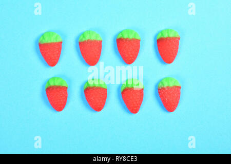 group of jelly candies  Strawberry  on blue background Stock Photo