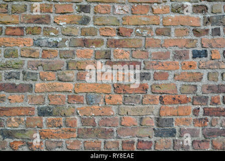 A brick wall showing multi coloured shaded contrasting bricks Stock Photo