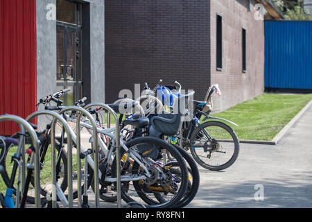 City bike parking near the modern building Stock Photo