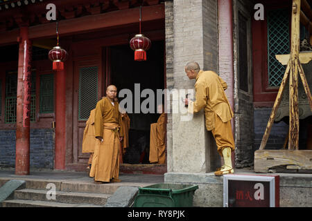 Chinese monks in buddhist temple, Wutai Shan, Shanxi, China Stock Photo