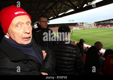 Wrexham football fan wearing red favours ar Wrexham v Chesterfield football game March 2nd 2019 Stock Photo