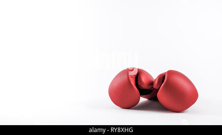 A pair of boxing gloves. Ready to fight. Concepts for martial arts, boxing lessons, boxercise and workout, etc. Place for own text / copy space. Stock Photo