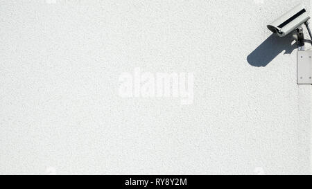 CCTV. Surveillance camera on concrete wall. Blank empty copy space for own text. Stock Photo
