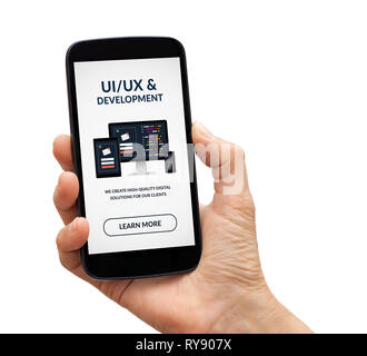 Hand holding a black smart phone with UI/UX design and development concept on screen. Isolated on white background. All screen content is designed by  Stock Photo
