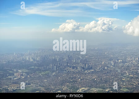 Aerial Shot of Metro Manila Metropolis on sunny day -  Philippines