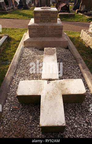 fallen cross laid out on a grave, damage, Stock Photo