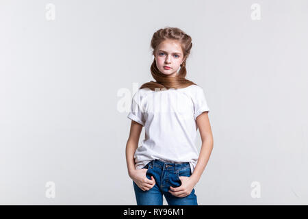 Calm long-haired pretty girl posing on camera Stock Photo