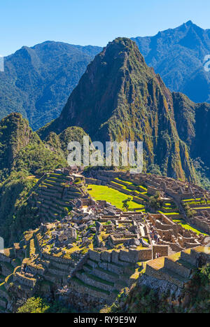 Vertical photograph of the Incan ruin of Machu Picchu with the Huayna Picchu mountain peak in the background, Cusco Province, Peru. Stock Photo