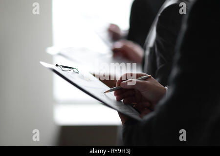 close up.businessman with clipboard checking financial report Stock Photo