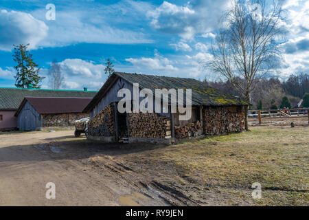 Old Russian palennitsa for storing firewood for the winter, the old barn Stock Photo