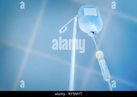 Private medicine. Anesthesia. Traditional medicine. Infusion drip, drop counter in hospital background. Preparing for surgery. Painless concept Stock Photo