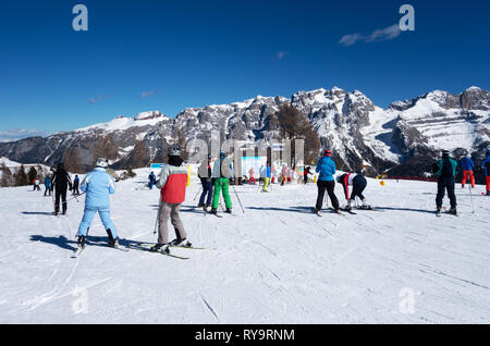 Skiing Italy - Skiers skiing on the ski slopes at Madonna di Campiglio, Brenta Dolomites, northern Italy Europe Stock Photo