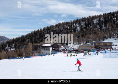 Skiing Italy - Skiers skiing on the ski slopes at Madonna di Campiglio, Brenta Dolomites, northern Italy Europe Stock Photo