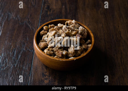 Dried Date Fruit Pieces in Wooden Bowl / Organic Dry Fruit Snacks. Healthy Appetizer. Stock Photo