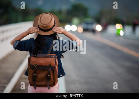 Female tourists spread their arms and held their wings, smiling happily. Stock Photo