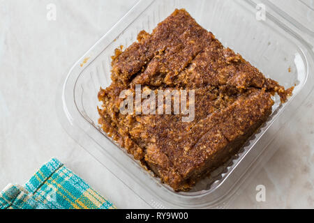 Organic Date Fruit Paste Dough in Plastic Box Container / Package for Breakfast. Stock Photo