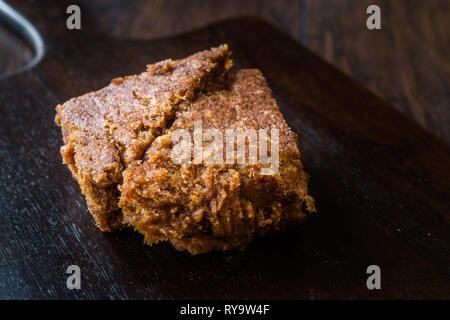 Organic Date Fruit Paste Dough on Dark Wooden Surface for Breakfast. Stock Photo
