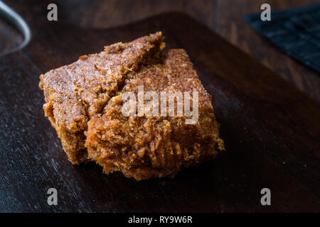 Organic Date Fruit Paste Dough on Dark Wooden Surface for Breakfast. Stock Photo