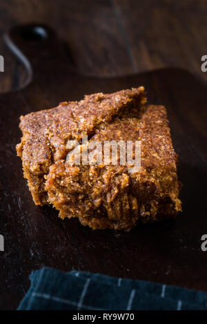 Organic Date Fruit Paste Dough on Dark Wooden Surface for Breakfast. Stock Photo