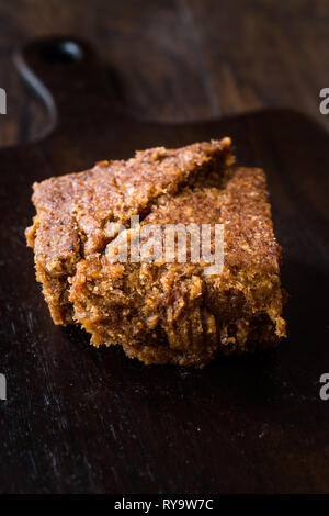 Organic Date Fruit Paste Dough on Dark Wooden Surface for Breakfast. Stock Photo
