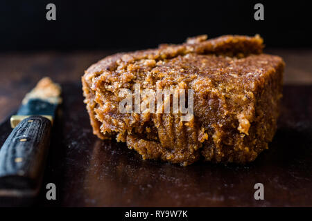 Organic Date Fruit Paste Dough on Dark Wooden Surface for Breakfast. Stock Photo