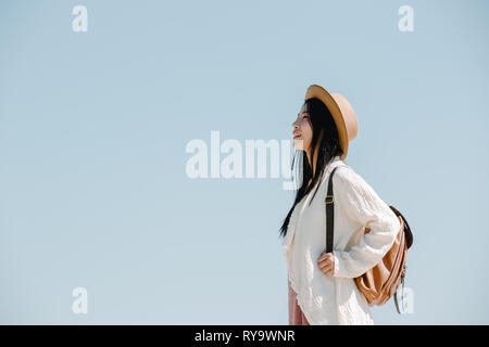Female tourists spread their arms and held their wings, smiling happily. Stock Photo