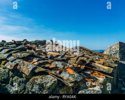 Close-up of old weathered roof tiles, broken, with moss growing on them. Monsanto, Portugal,  Europe, EU, Stock Photo