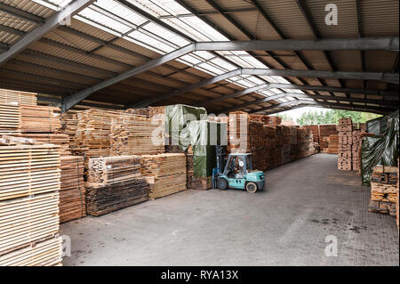 Forklift in lumber warehouse