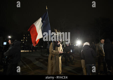 Denmark, Copenhagen - February 16, 2015. A man carries the French flag at tonight’s massive commemoration after the terror attacks in Copenhagen. In January the French satirical magazine Charlie Hebdo’s offices were attacked in Paris. (Photo credit: Kenneth Nguyen - Gonzales Photo). Stock Photo