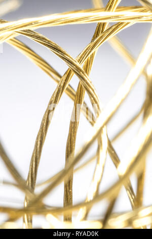 Golden wires isolated on bright background Stock Photo