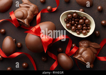 Easter composition with chocolate eggs and bunnies Stock Photo