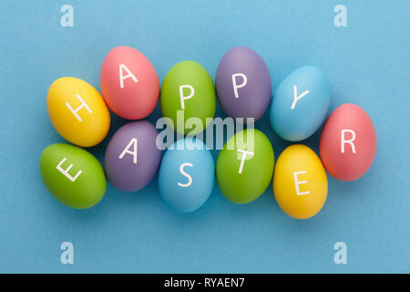 Painted eggs arranged in Happy Easter greeting Stock Photo