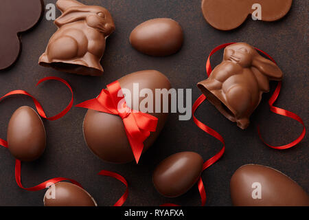 Easter composition with chocolate eggs and bunnies Stock Photo