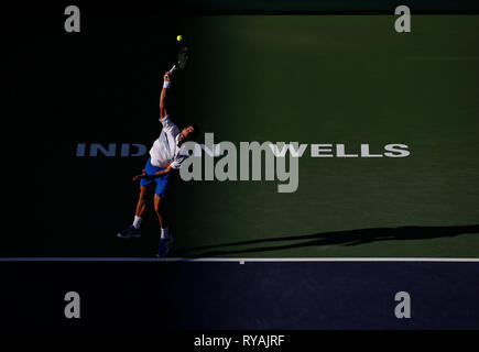 Indian Wells, California, USA. 12th Mar 2019. Novak Djokovic (SRB) serves against Philipp Kohlschreiber (GER) during the 2019 BNP Paribas Open at Indian Wells Tennis Garden in Indian Wells, California. Charles Baus/CSM Credit: Cal Sport Media/Alamy Live News Stock Photo