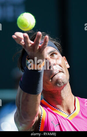 Indian Wells, USA. 12th Mar, 2019. Rafael Nadal of Spain serves during the men's singles third round match of the BNP Paribas Open tennis tournament against Diego Schwartzman of Argentina in Indian Wells, California, the United States, March 12, 2019. Nadal won 2-0. Credit: Zhao Hanrong/Xinhua/Alamy Live News Stock Photo