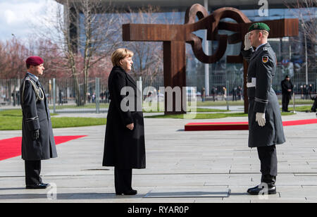 Berlin, Germany. 13th Mar, 2019. Federal Chancellor Angela Merkel (CDU) is greeted by the Bundeswehr guard battalion before the visit of Lao Prime Minister Sisoulith to the Federal Chancellery. Credit: Bernd von Jutrczenka/dpa/Alamy Live News Stock Photo