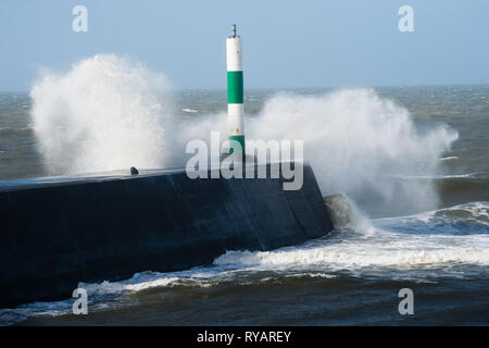 Aberystwyth, UK. 13th Mar, 2019. UK Weather: Gale force winds from Storm Gareth - the third named storm of 2019 - hit Aberystwyth on the Cardigan Bay coast, West Wales UK on Wednesday afternoon. Gusts of up to 70 or 80mph are forecast in exposed Northern regions, with the risk of serious damage to property and severe disruption to travel and power services Photo Credit: keith morris/Alamy Live News Stock Photo