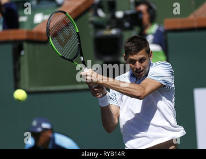 Los Angeles, California, USA. 12th Mar, 2019. Filip Krajinovic of Serbia, returns the ball to Rafael Nadal of Spain during the men singles fourth round match of the BNP Paribas Open tennis tournament on Wednesday, March 13, 2019 in Indian Wells, California. Nadal won 2-0. Credit: Ringo Chiu/ZUMA Wire/Alamy Live News Stock Photo