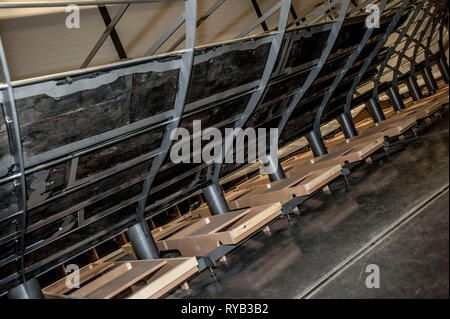 Views of surviving timbers from longest Viking warship ever found displayed in the UK for the first time. The timbers have been painstakingly fitted together like a huge jigsaw and placed inside an actual size steel cradle . The reconstruction work is by members National Museum of Denmark who have come over to the Museum especially.     The 37 metre long ship will form the centrepiece of the British Museum's BP exhibition, Vikings: life and legend.  The ship, known as Roskilde 6, was excavated from the banks of Roskilde fjord in Denmark during the course of work undertaken to develop the Roski Stock Photo