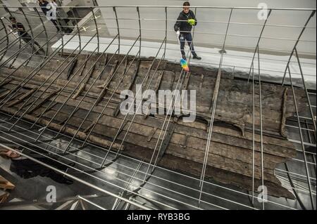 Views of surviving timbers from longest Viking warship ever found displayed in the UK for the first time. The timbers have been painstakingly fitted together like a huge jigsaw and placed inside an actual size steel cradle . The reconstruction work is by members National Museum of Denmark who have come over to the Museum especially.     The 37 metre long ship will form the centrepiece of the British Museum's BP exhibition, Vikings: life and legend.  The ship, known as Roskilde 6, was excavated from the banks of Roskilde fjord in Denmark during the course of work undertaken to develop the Roski Stock Photo