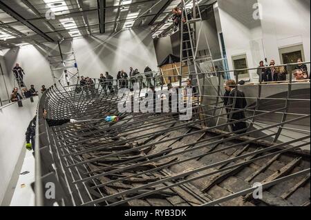 Views of surviving timbers from longest Viking warship ever found displayed in the UK for the first time. The timbers have been painstakingly fitted together like a huge jigsaw and placed inside an actual size steel cradle . The reconstruction work is by members National Museum of Denmark who have come over to the Museum especially.     The 37 metre long ship will form the centrepiece of the British Museum's BP exhibition, Vikings: life and legend.  The ship, known as Roskilde 6, was excavated from the banks of Roskilde fjord in Denmark during the course of work undertaken to develop the Roski Stock Photo