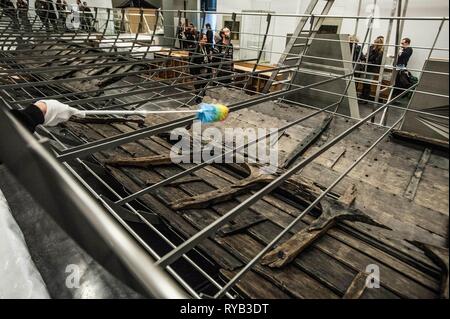 Views of surviving timbers from longest Viking warship ever found displayed in the UK for the first time. The timbers have been painstakingly fitted together like a huge jigsaw and placed inside an actual size steel cradle . The reconstruction work is by members National Museum of Denmark who have come over to the Museum especially.     The 37 metre long ship will form the centrepiece of the British Museum's BP exhibition, Vikings: life and legend.  The ship, known as Roskilde 6, was excavated from the banks of Roskilde fjord in Denmark during the course of work undertaken to develop the Roski Stock Photo