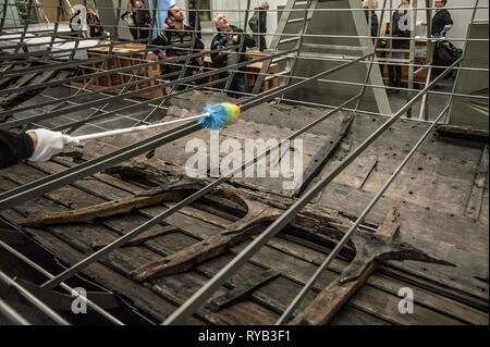 Views of surviving timbers from longest Viking warship ever found displayed in the UK for the first time. The timbers have been painstakingly fitted together like a huge jigsaw and placed inside an actual size steel cradle . The reconstruction work is by members National Museum of Denmark who have come over to the Museum especially.     The 37 metre long ship will form the centrepiece of the British Museum's BP exhibition, Vikings: life and legend.  The ship, known as Roskilde 6, was excavated from the banks of Roskilde fjord in Denmark during the course of work undertaken to develop the Roski Stock Photo