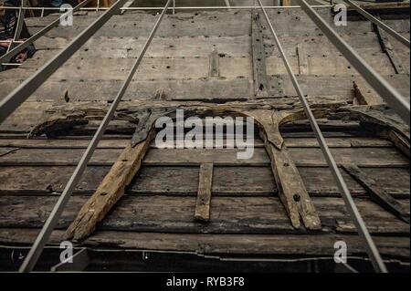 Views of surviving timbers from longest Viking warship ever found displayed in the UK for the first time. The timbers have been painstakingly fitted together like a huge jigsaw and placed inside an actual size steel cradle . The reconstruction work is by members National Museum of Denmark who have come over to the Museum especially.     The 37 metre long ship will form the centrepiece of the British Museum's BP exhibition, Vikings: life and legend.  The ship, known as Roskilde 6, was excavated from the banks of Roskilde fjord in Denmark during the course of work undertaken to develop the Roski Stock Photo