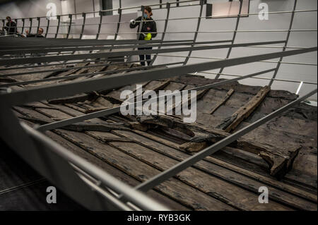 Views of surviving timbers from longest Viking warship ever found displayed in the UK for the first time. The timbers have been painstakingly fitted together like a huge jigsaw and placed inside an actual size steel cradle . The reconstruction work is by members National Museum of Denmark who have come over to the Museum especially.     The 37 metre long ship will form the centrepiece of the British Museum's BP exhibition, Vikings: life and legend.  The ship, known as Roskilde 6, was excavated from the banks of Roskilde fjord in Denmark during the course of work undertaken to develop the Roski Stock Photo