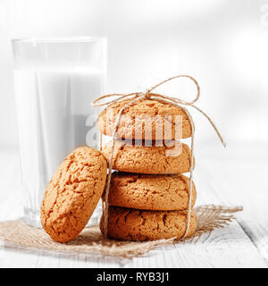 Oatmeal cookies and fresh milk. The concept is healthy food, breakfast, vegetarianism. Stock Photo
