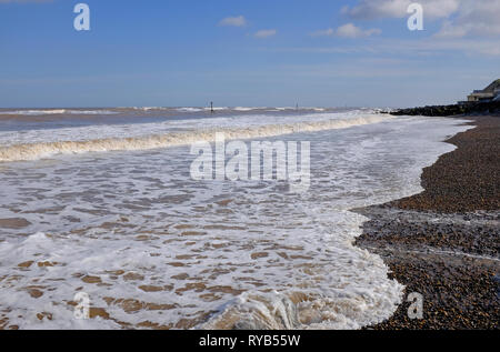 white surf foam in seashore landscape, sheringham, north norfolk, england Stock Photo